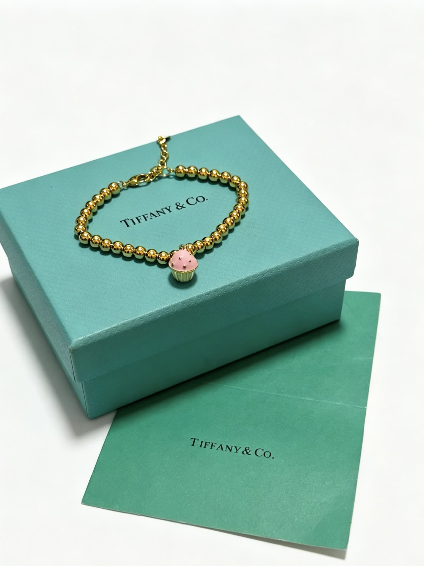 Tiffany & Co. Gold Bead Bracelet with Cupcake Charm